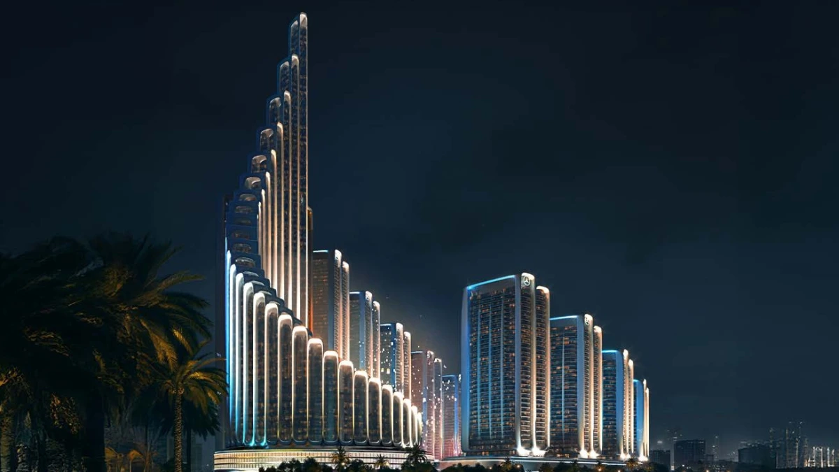 Night exterior view of Mercedes Benz Places-Binghatti City highlighting stepped high rise towers with illuminated vertical lines, curved podium edges, palm landscaping, and the surrounding Dubai skyline. Presented by Tohid Fetrat.