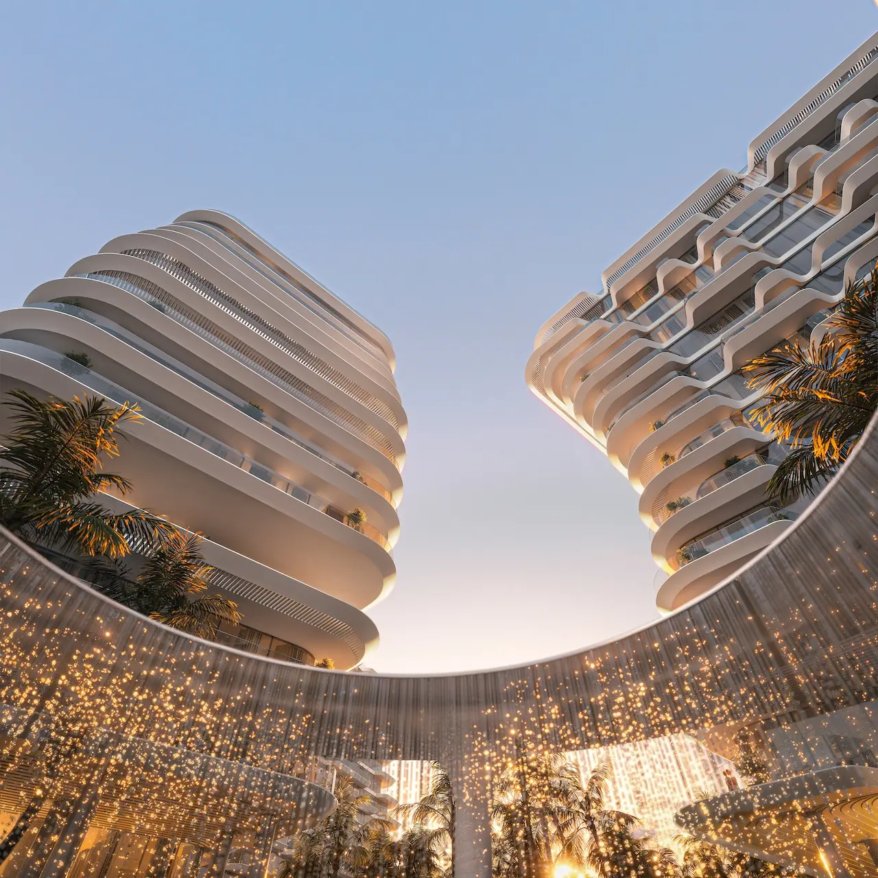 Arrival water feature at Passo by Beyond on Palm Jumeirah, featuring cascading illuminated water curtains framed by sculpted curved towers and contemporary luxury architecture. Presented by Tohid Fetrat.