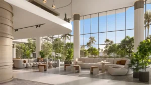 Glass Box Bella living lounge at Passo by Beyond Palm Jumeirah featuring double height ceilings floor to ceiling glass lush greenery natural light and refined modern interior design overlooking landscaped gardens. Presented by Tohid Fetrat.