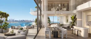 Luxury penthouse dining and open living space at Passo by Beyond Palm Jumeirah featuring double height interiors a private infinity pool seamless indoor outdoor design and panoramic Dubai skyline and waterfront views. Presented by Tohid Fetrat.