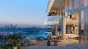Luxury penthouse terrace at Passo by Beyond Palm Jumeirah featuring a private infinity pool spacious outdoor lounge floor to ceiling glass interiors and panoramic Dubai skyline and waterfront views. Presented by Tohid Fetrat.