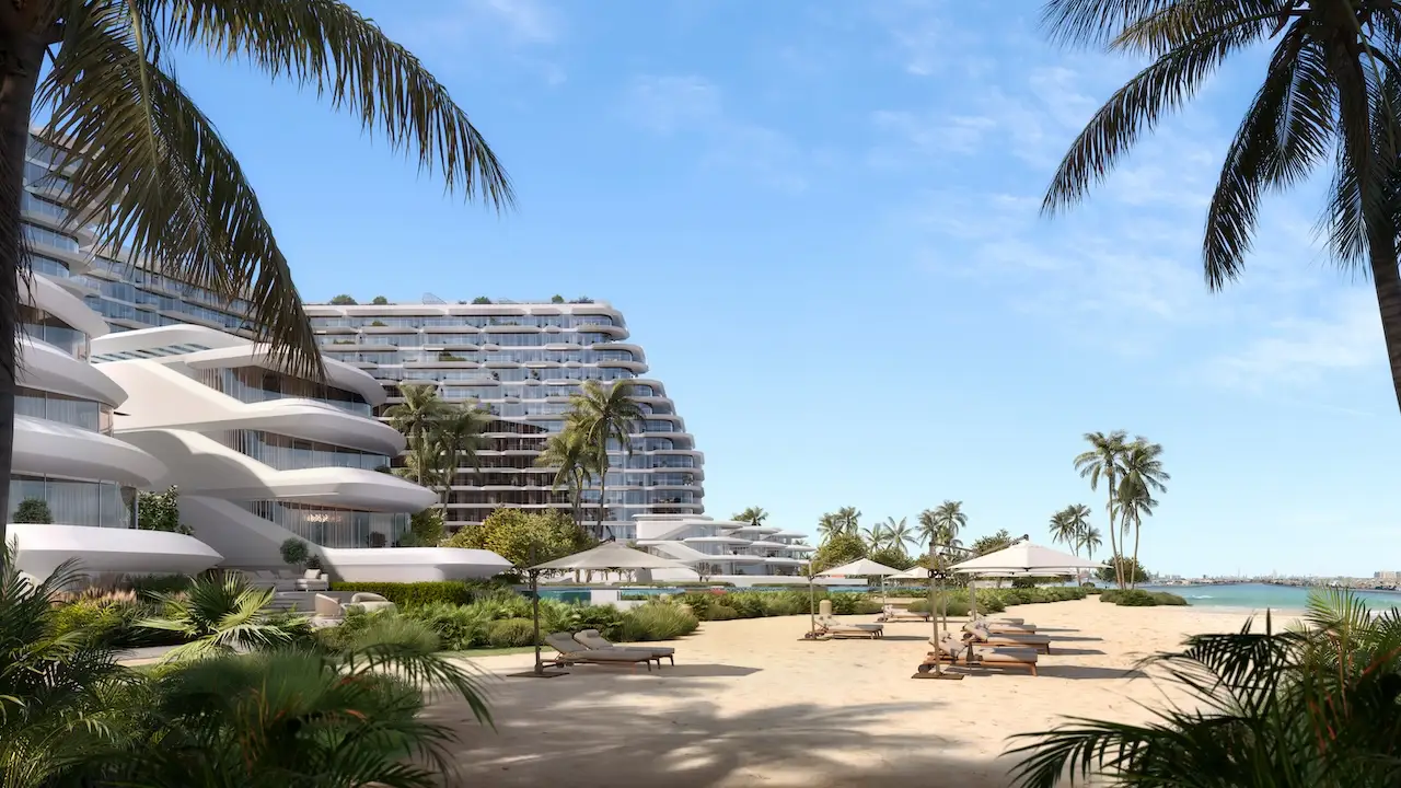 Private beach view at Passo by Beyond on Palm Jumeirah, showcasing luxury waterfront residences, shaded sun loungers, palm-lined sands, and direct access to the Gulf in one of Dubai’s most exclusive coastal communities. Presented by Tohid Fetrat.