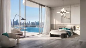 Two bedroom master bedroom at Passo by Beyond Palm Jumeirah featuring floor to ceiling windows panoramic sea and Dubai skyline views refined contemporary design and elegant waterfront bedroom layout. Presented by Tohid Fetrat.