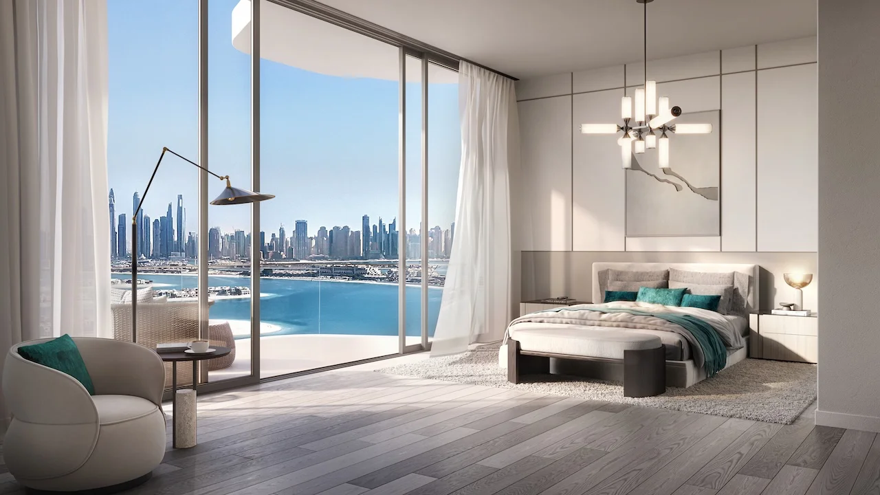 Two bedroom master bedroom at Passo by Beyond Palm Jumeirah featuring floor to ceiling windows panoramic sea and Dubai skyline views refined contemporary design and elegant waterfront bedroom layout. Presented by Tohid Fetrat.