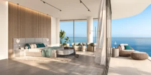 Four bedroom master bedroom at Passo by Beyond Palm Jumeirah featuring floor to ceiling windows open sea views private terrace seating refined contemporary design and luxury waterfront living. Presented by Tohid Fetrat.