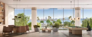 Social club lounge at Passo by Beyond Palm Jumeirah featuring panoramic waterfront views seating areas billiards table and refined contemporary interior design. Presented by Tohid Fetrat.