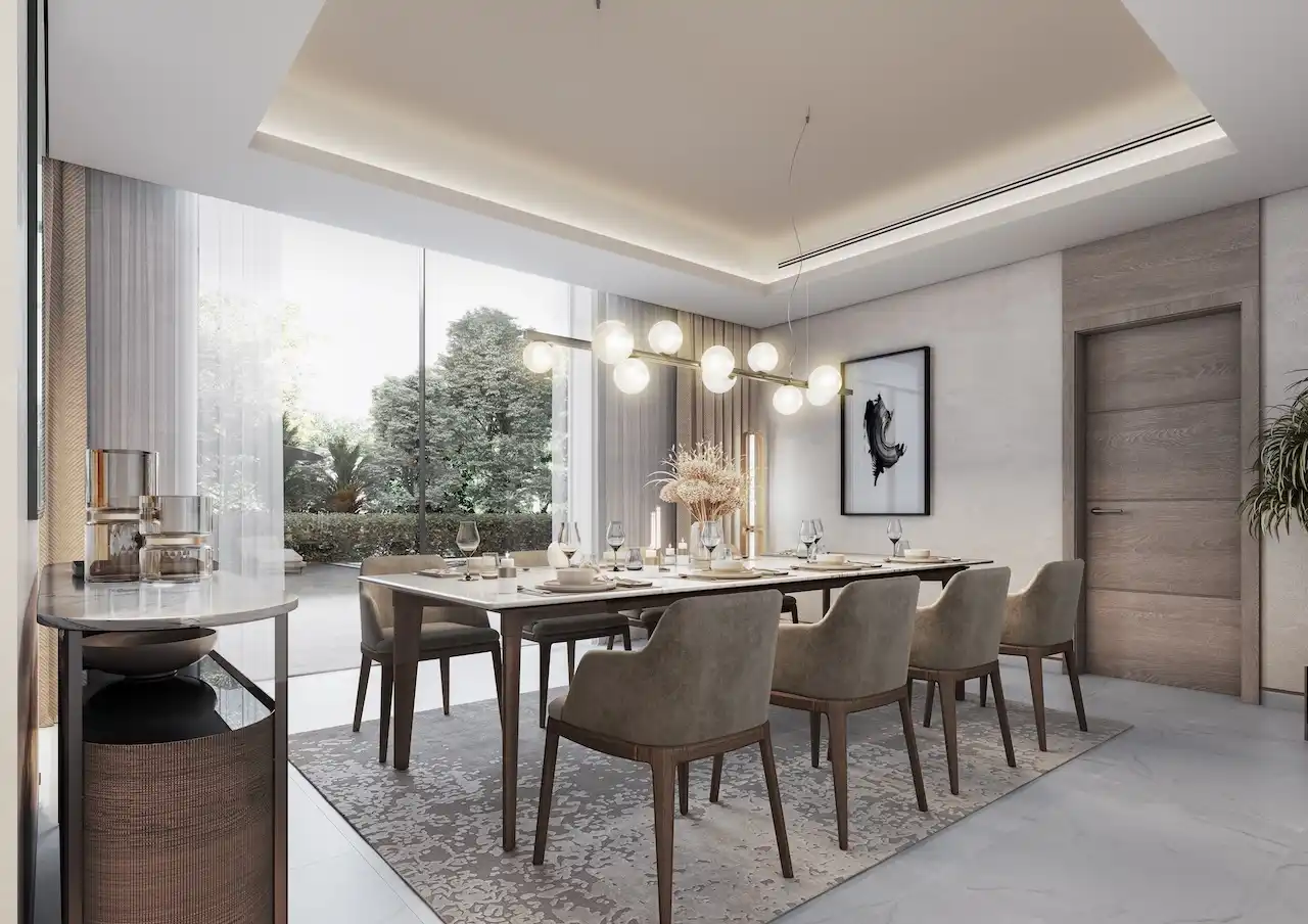 Formal dining room interior of a 4 bedroom Type A villa at Sobha Elwood featuring a large dining table, modern pendant lighting, floor-to-ceiling windows, and elegant contemporary finishes designed for luxury villa living in Dubai, Presented by Tohid Fetrat