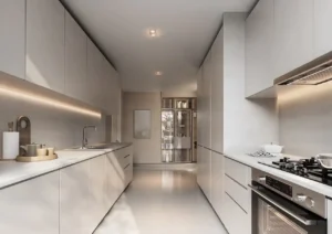 Modern kitchen interior of a 4 bedroom Type A villa at Sobha Elwood featuring sleek built-in cabinetry, integrated appliances, stone countertops, and minimalist contemporary design for luxury villa living in Dubai, Presented by Tohid Fetrat