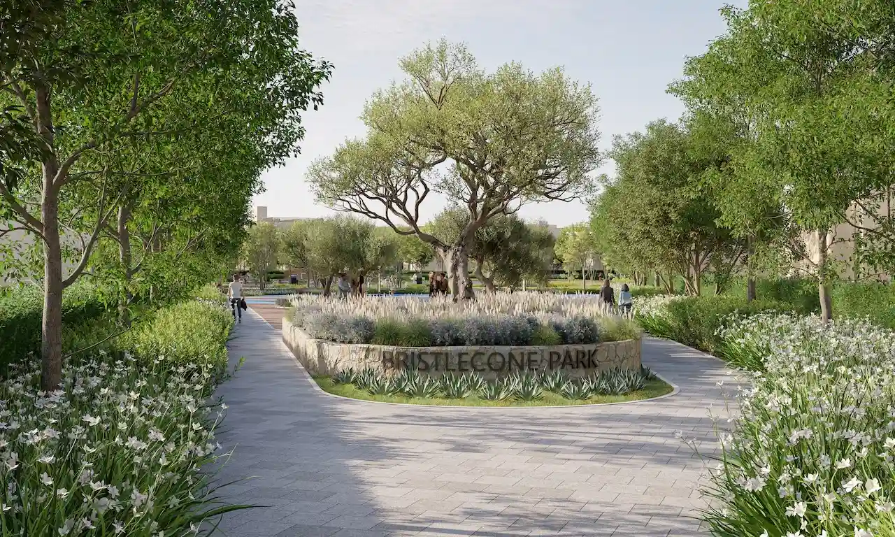 Bristlecone Park entrance at Sobha Elwood featuring landscaped walkways, mature trees, and lush greenery, creating a serene outdoor environment within a master-planned residential community in Dubai, Presented by Tohid Fetrat