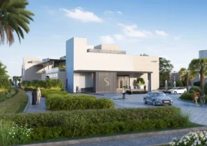 Exterior entrance view of the Sobha Elwood clubhouse featuring contemporary architecture, landscaped arrival plaza, water features, and a refined community lifestyle setting in Dubai, Presented by Tohid Fetrat