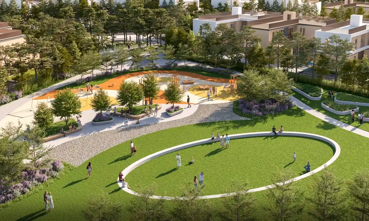 Aerial view of Taiga Park in Sobha Elwood, showcasing landscaped green lawns, family activity zones, walking paths, and community seating areas within a master-planned residential community in Dubai, Presented by Tohid Fetrat