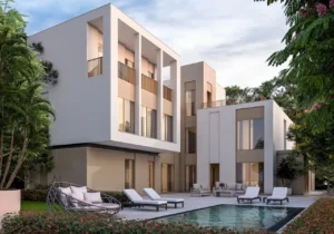 Courtyard view of the Type 6A villa at Sobha Elwood featuring contemporary multi-level architecture, a private swimming pool, floor-to-ceiling windows, and landscaped outdoor seating within a luxury master-planned community in Dubai, Presented by Tohid Fetrat