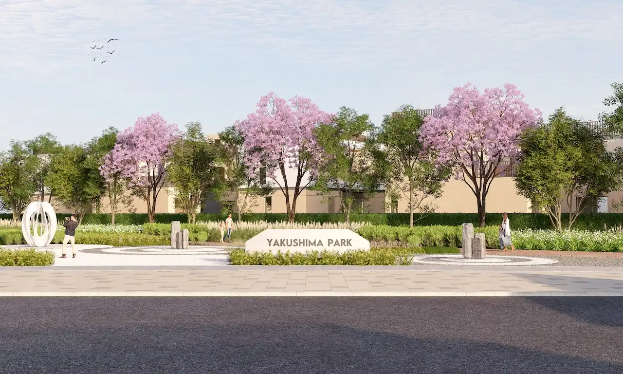 Front entrance view of Yakushima Park at Sobha Elwood featuring cherry blossom trees, landscaped gardens, and pedestrian pathways within a master-planned residential community in Dubai, Presented by Tohid Fetrat