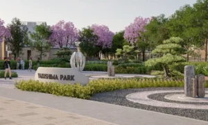 Side entrance view of Yakushima Park at Sobha Elwood showcasing Japanese-inspired garden elements, cherry blossom trees, stone features, and landscaped pathways within a master-planned residential community in Dubai, Presented by Tohid Fetrat