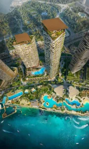 Aerial masterplan view of Soulever featuring twin waterfront towers, resort style pools, landscaped podiums, and direct Gulf frontage, showcasing ultra luxury coastal living in Dubai. Presented by Tohid Fetrat.