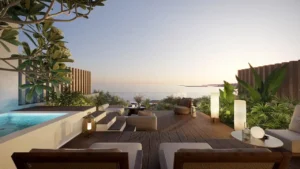 Private chalet terrace at Soulever featuring an outdoor lounge, timber deck, lush landscaping, and panoramic Gulf sunset views in a luxury residential development in Dubai. Presented by Tohid Fetrat.