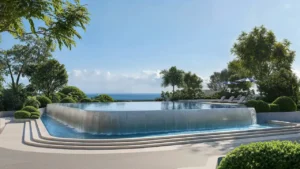 Overflow infinity pool at Soulever surrounded by landscaped gardens, offering serene seafront views of the Gulf in Dubai. Presented by Tohid Fetrat.