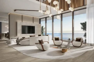 Double height penthouse living room at Soulever with panoramic Gulf views, floor to ceiling windows, sculptural lighting, and refined contemporary furniture in Dubai. Presented by Tohid Fetrat.