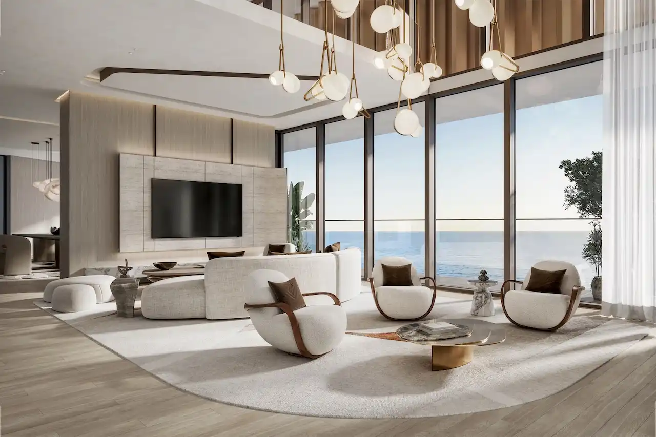 Double height penthouse living room at Soulever with panoramic Gulf views, floor to ceiling windows, sculptural lighting, and refined contemporary furniture in Dubai. Presented by Tohid Fetrat.