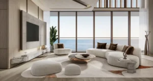 Luxury penthouse living room at Soulever with panoramic Gulf views, floor to ceiling glass, sculptural furniture, and refined contemporary interiors in Dubai. Presented by Tohid Fetrat.
