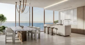 Luxury dining area in a three bedroom apartment at Soulever featuring floor to ceiling windows, open plan kitchen, sea view, refined modern design, and premium finishes in Dubai. Presented by Tohid Fetrat.
