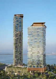 Daytime view of Soulever twin residential towers rising above landscaped podiums with direct Gulf frontage, showcasing contemporary waterfront architecture and ultra luxury living in Dubai. Presented by Tohid Fetrat.