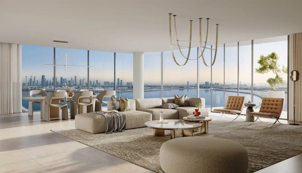 Luxury three-bedroom living and dining interior at The Edit at d3 with panoramic floor-to-ceiling windows, contemporary open-plan layout, refined neutral finishes, and Dubai skyline and waterfront views in Dubai Design District, Presented by Tohid Fetrat