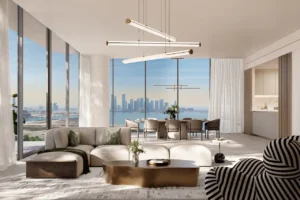 Luxury four-bedroom living and dining interior at The Edit at d3 featuring an open-plan layout, bespoke lighting, floor-to-ceiling windows, and panoramic Dubai skyline and waterfront views in Dubai Design District, Presented by Tohid Fetrat