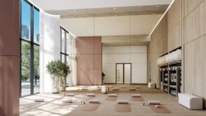 Calm yoga and wellness studio with natural light, floor-to-ceiling windows, mirrors, and yoga mats at The Edit at d3 in Dubai Design District, Presented by Tohid Fetrat