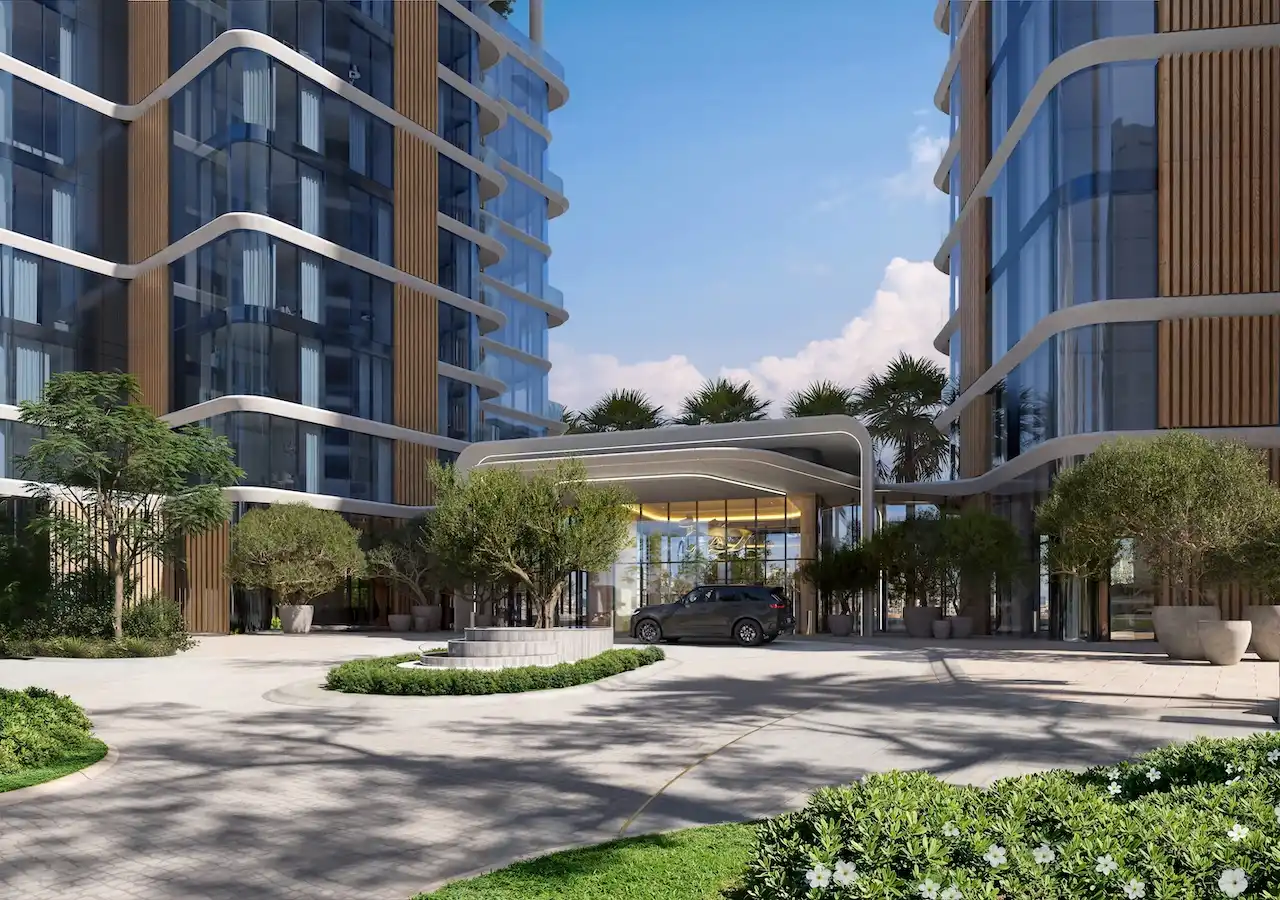 Main entrance and drop-off area with contemporary architecture, landscaped driveway, and glass façade at The Edit at d3 in Dubai Design District, Presented by Tohid Fetrat