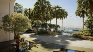 Outdoor landscaped amenity at The Edit at d3 featuring palm-lined walkways, tranquil water features, shaded seating areas, and a serene waterfront-inspired setting in Dubai Design District, Presented by Tohid Fetrat