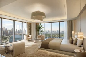 Luxury penthouse master bedroom interior at The Edit at d3 featuring floor-to-ceiling windows, panoramic Dubai skyline and waterfront views, refined neutral tones, and elegant contemporary design, Presented by Tohid Fetrat
