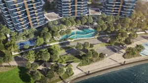 Aerial view of the waterfront swimming pool and landscaped amenities at The Edit at d3, surrounded by palm trees and modern residential towers in Dubai Design District, Presented by Tohid Fetrat