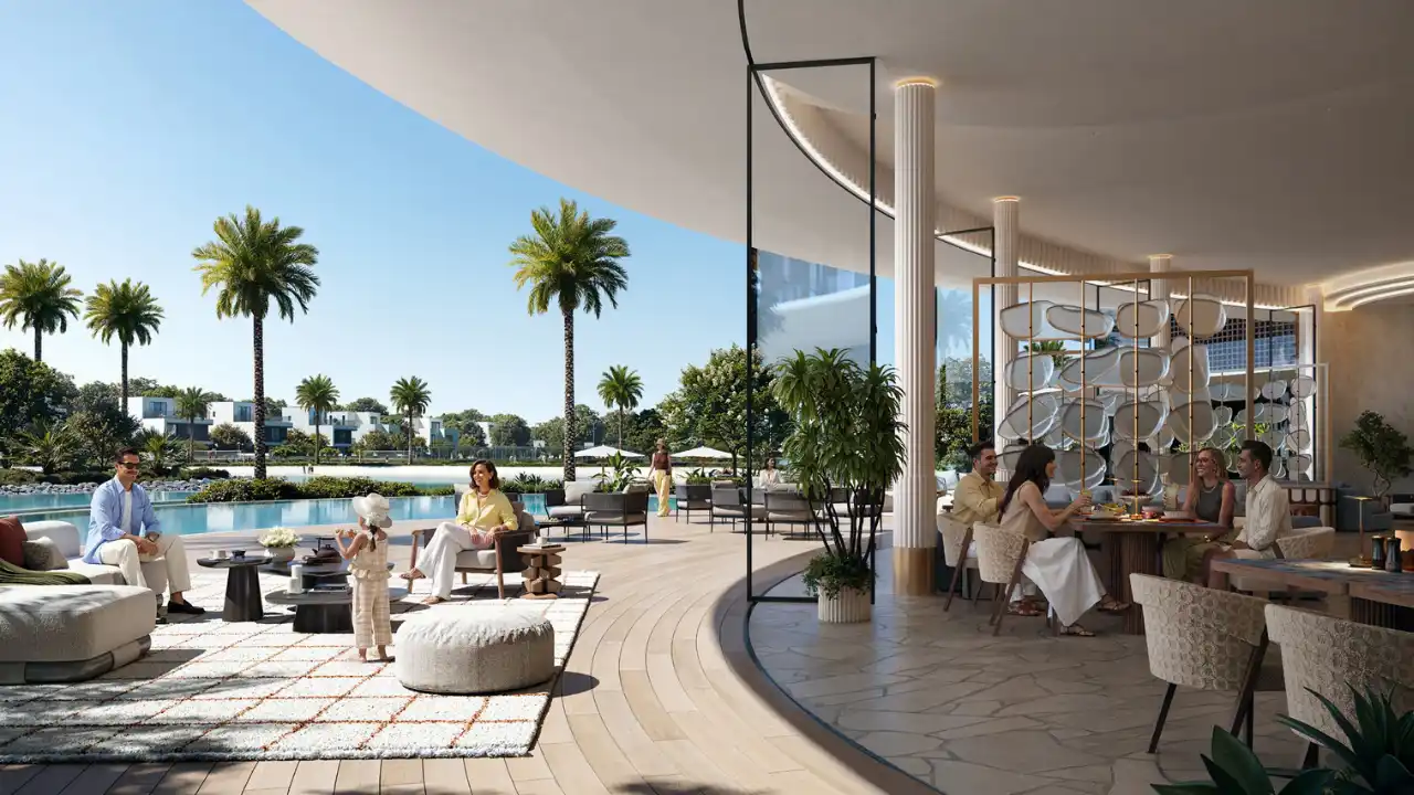 Residents enjoying a community lounge and restaurant overlooking the lagoon at The Heights by Emaar, featuring resort style seating, dining spaces, and a relaxed lifestyle in a master planned community in Dubai. Presented by Tohid Fetrat.