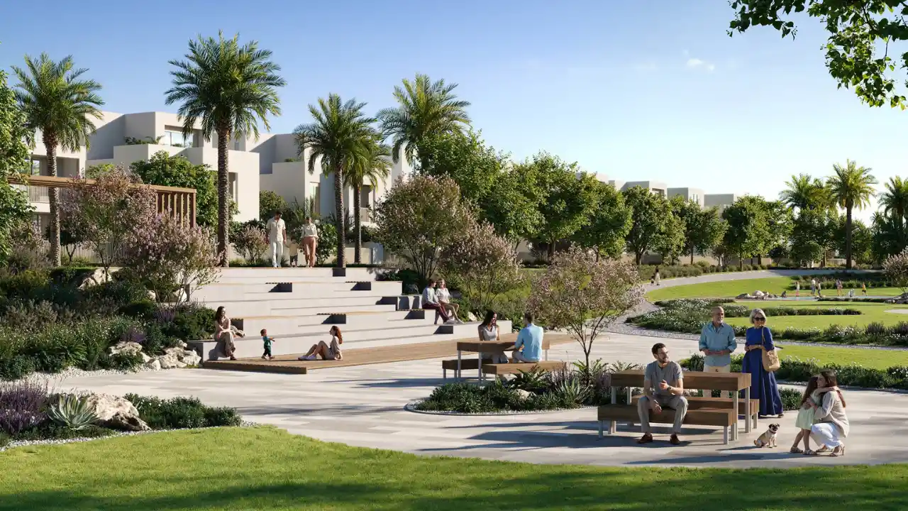 Landscaped community park at The Heights by Emaar featuring green open spaces, shaded seating areas, walking paths, and a family friendly outdoor lifestyle in Dubai. Presented by Tohid Fetrat.