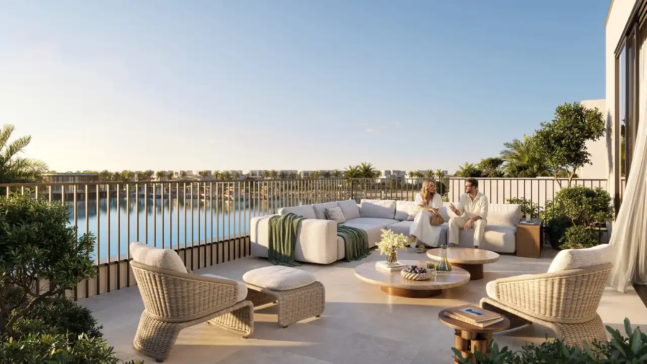 Private villa terrace overlooking the lagoon at The Heights by Emaar, featuring outdoor seating, water views, and a relaxed luxury lifestyle in Dubai. Presented by Tohid Fetrat.