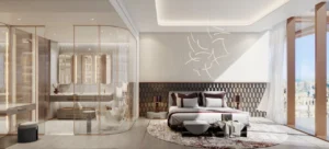 Luxury master bedroom interior in a 1 bedroom apartment at The Symphony Tower by Imtiaz featuring an en-suite bathroom, elegant finishes, soft textures, and contemporary design in Dubai, Presented by Tohid Fetrat