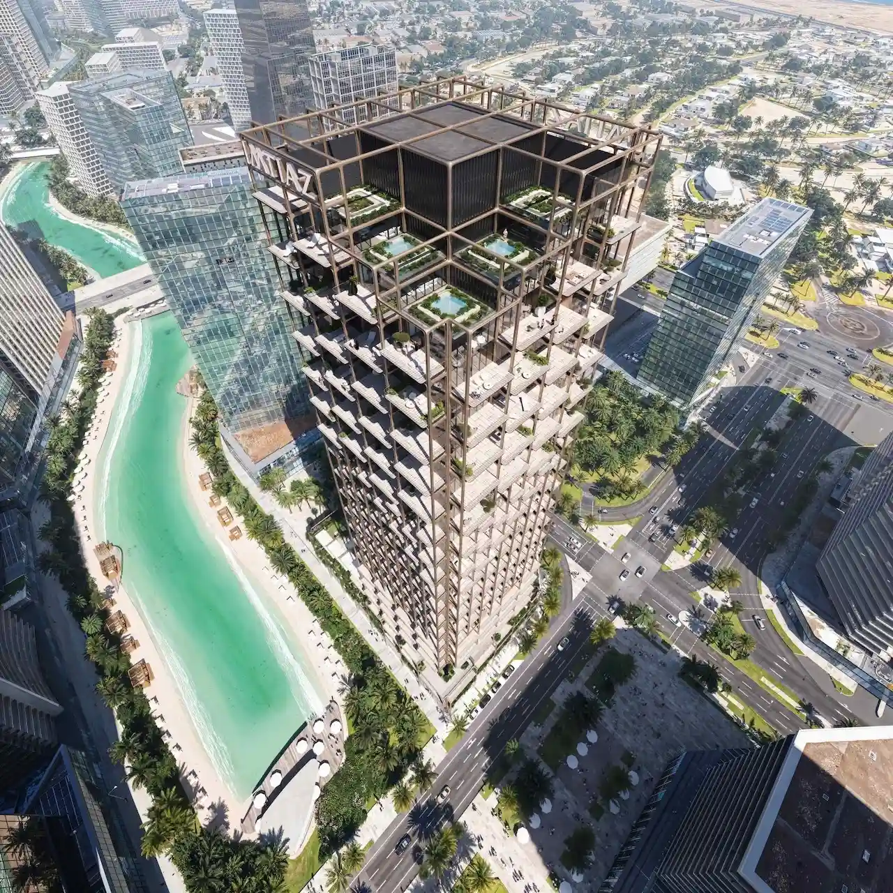 Aerial top view of The Symphony Tower by Imtiaz, showcasing its distinctive stepped architecture, rooftop terraces with pools, and prime beachfront location surrounded by Dubai’s urban skyline, Presented by Tohid Fetrat