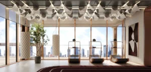 Luxury gym and fitness center interior at The Symphony Tower by Imtiaz featuring designer treadmills, sculptural ceiling elements, punching bags, floor-to-ceiling windows, and panoramic Dubai skyline views, Presented by Tohid Fetrat