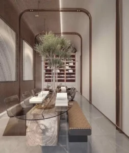 Luxury library and study room interior at The Symphony Tower by Imtiaz showcasing a sculptural solid-wood and glass table, indoor tree centerpiece, designer transparent chairs, custom bookshelves, and refined contemporary detailing, Presented by Tohid Fetrat