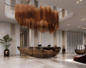 Luxury lobby interior at The Symphony Tower by Imtiaz featuring a sculptural chandelier, elegant reception desk, marble finishes, and contemporary design, Presented by Tohid Fetrat