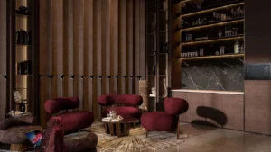 Luxury office lounge and bar interior at The Symphony Tower by Imtiaz featuring sculptural seating, warm ambient lighting, marble bar backdrop, premium shelving, and refined contemporary design, Presented by Tohid Fetrat