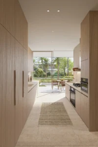 Bay Villas Garden Villa Type C kitchen at Island B Dubai Islands by Nakheel featuring modern wooden cabinetry and garden view Presented by Tohid Fetrat