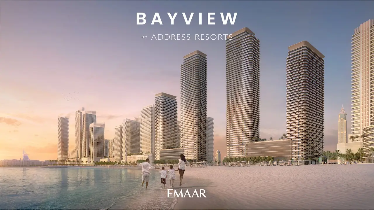Beachfront lifestyle view at Bayview by Address Resorts in Emaar Beachfront, featuring luxury waterfront towers, family walking along the shore, Dubai skyline, and Gulf views at sunset, Presented by Tohid Fetrat