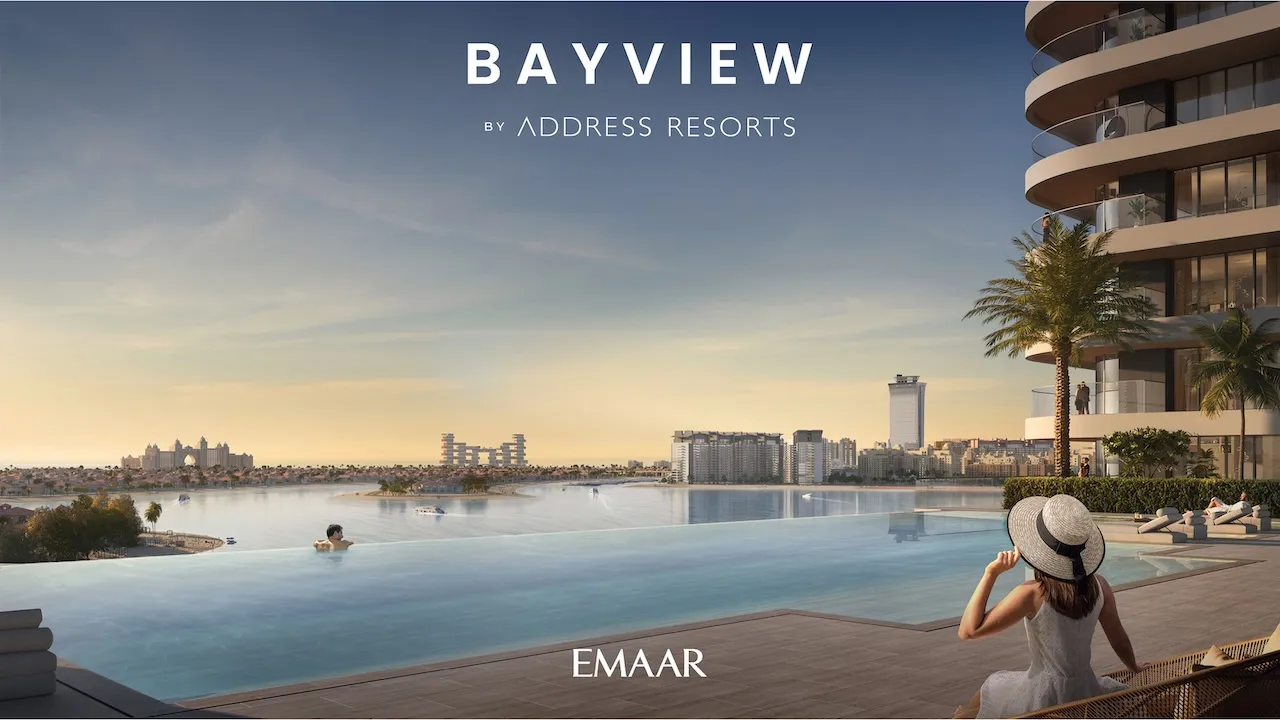 Waterfront infinity pool render of Bayview by Address Resorts at Emaar Beachfront, showcasing sunset views, calm lagoon waters, luxury poolside seating, and elevated seaside living overlooking the Gulf, Presented by Tohid Fetrat