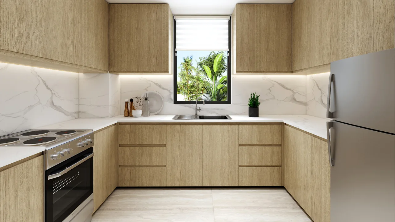 Bahamas at DAMAC Islands 2 modern villa kitchen interior with minimalist cabinetry marble backsplash and contemporary open layout Bermuda community Dubai Presented by Tohid Fetrat
