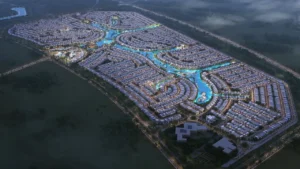 Mauritius at DAMAC Islands 2 evening aerial masterplan with illuminated lagoon waterways and villa community layout Dubai Presented by Tohid Fetrat