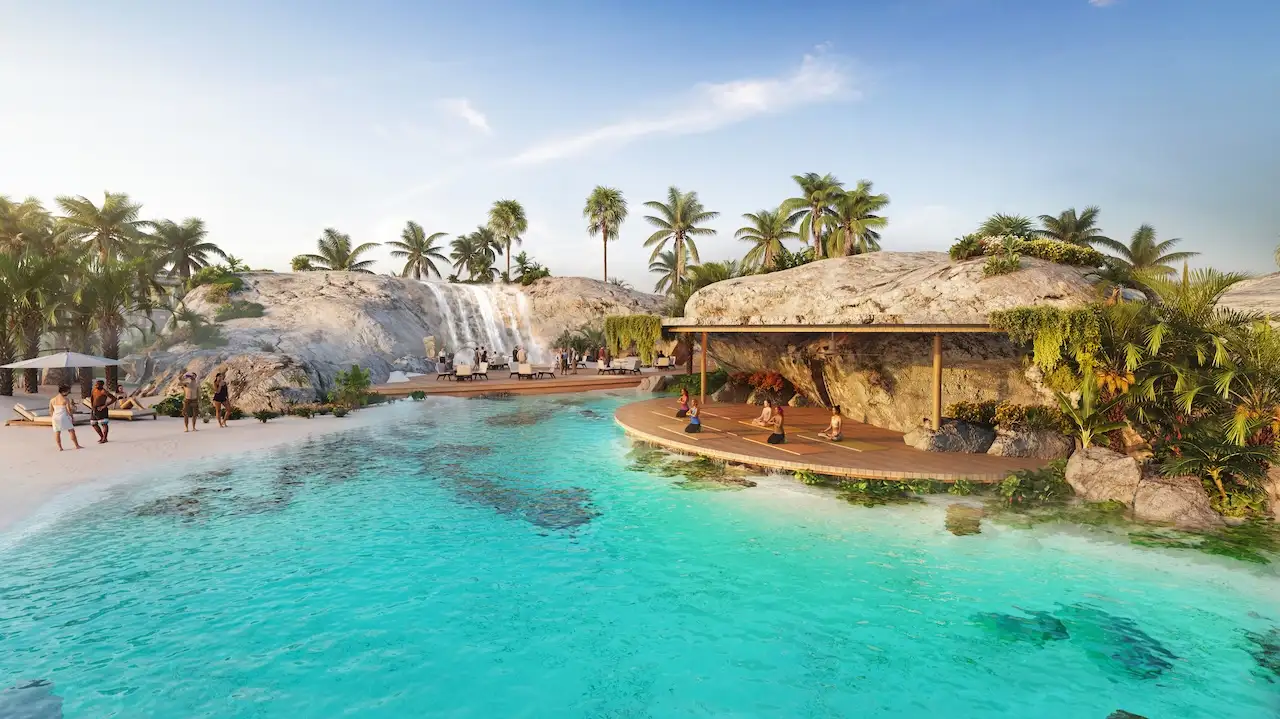 Mauritius at DAMAC Islands 2 lagoon waterfall leisure area with beach seating relaxation decks and waterfront community setting Dubai Presented by Tohid Fetrat