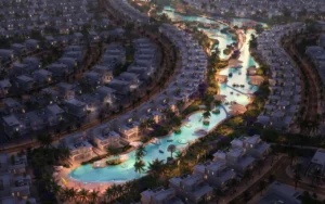 Tahiti at DAMAC Islands 2 night lagoon view with illuminated waterfront villas and landscaped community Dubai Presented by Tohid Fetrat
