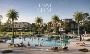 Farm Grove community pool surrounded by palm trees sun loungers and landscaped open spaces within The Valley Dubai Presented by Tohid Fetrat
